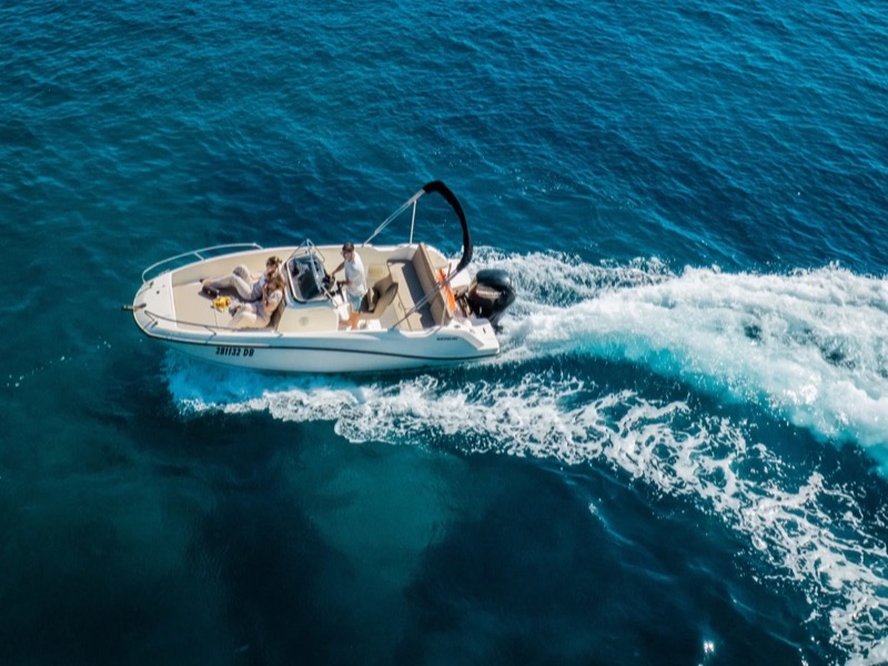 One of our RIB speedboats cutting across calm Adriatic water