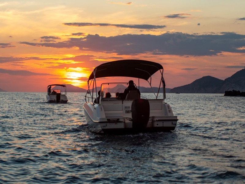 Golden-hour light inside the Blue Cave on a sunset tour from Dubrovnik